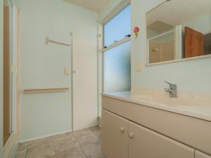 A bathroom at By The Beach - Whangamata Holiday Home