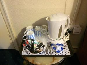 a coffee maker sitting on top of a table at The Crown Hotel in Horton in Ribblesdale