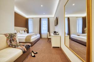Postel nebo postele na pokoji v ubytování Villa Tell rooms and suites