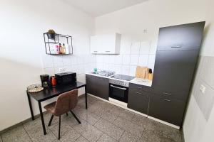 Η κουζίνα ή μικρή κουζίνα στο Langenfeld Apartment
