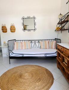 En eller flere senge i et værelse på Villa Rizia