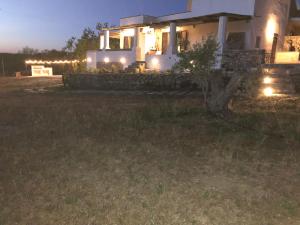 a house with lights in a yard at night at Dimora la Pinta ‘700 in Gallipoli
