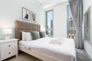En eller flere senge i et værelse på Ultimate Stay / 4 Beds / Burj Khalifa View