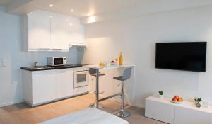 Kuchyň nebo kuchyňský kout v ubytování Magic Hotel & Apartments Kløverhuset