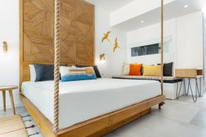 Кровать или кровати в номере Sunrise Attitude (Adults Only)