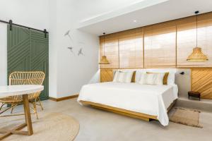 Кровать или кровати в номере Sunrise Attitude (Adults Only)