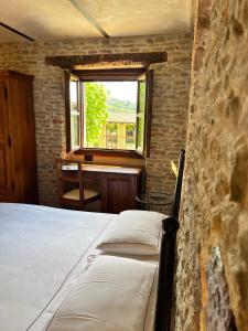 Postel nebo postele na pokoji v ubytování Relais Montemarino