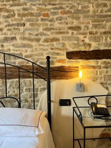Postel nebo postele na pokoji v ubytování Relais Montemarino