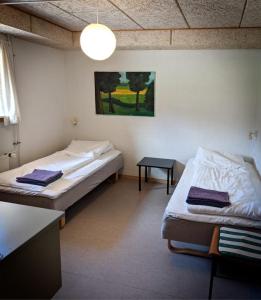 Postel nebo postele na pokoji v ubytování Skærum Mølle