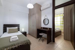 Postel nebo postele na pokoji v ubytování Lindos Olive Suites