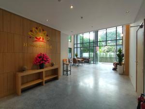 a lobby of a building with a sign on the wall at Hồng Gia Tuệ Lake View in Hanoi