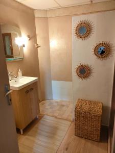 a bathroom with a sink and two mirrors on the wall at La maison d'Yvette - Gîte avec piscine, terrasse privée et vue in Le Barroux +31 photos