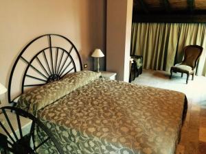 Ένα ή περισσότερα κρεβάτια σε δωμάτιο στο La Finestra sul Po - Agriturismo