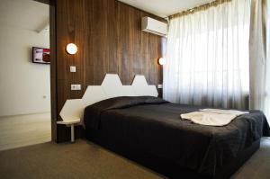Krevet ili kreveti u jedinici u okviru objekta Sports&Hotel Aqua Life Tower