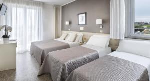 Postel nebo postele na pokoji v ubytování Hotel Carignano