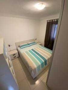 Postel nebo postele na pokoji v ubytování Apartments Kristina