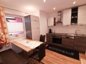 Kuchyň nebo kuchyňský kout v ubytování Sonnfeld Appartement