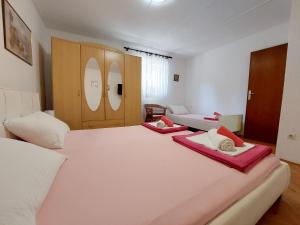 Posteľ alebo postele v izbe v ubytovaní Apartments Divano