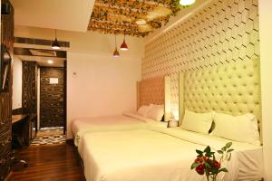 Cama o camas de una habitación en Hotel Heritage Inn at Assi Ghat