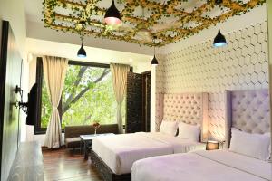Cama o camas de una habitación en Hotel Heritage Inn at Assi Ghat
