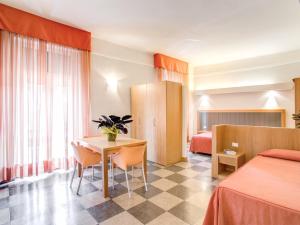 En eller flere senge i et værelse på Hotel Delle Nazioni