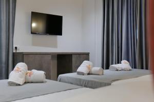 Postel nebo postele na pokoji v ubytování Hotel Eagle