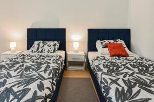 Posteľ alebo postele v izbe v ubytovaní NEW LUXURY 3 Bedroom 4 Air Conditioners