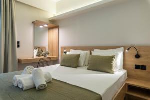 Posteľ alebo postele v izbe v ubytovaní POSEIDON SeaSide Deluxe Suites