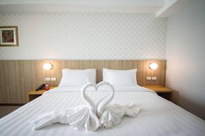 Postel nebo postele na pokoji v ubytování Marsi Hotel @ Bangchak