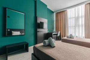 Postel nebo postele na pokoji v ubytování Arc Hotel Tirana
