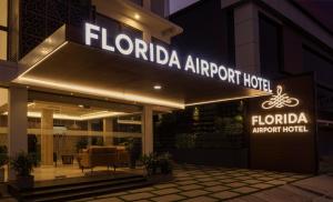 a sign for the front of a hotel at Florida Airport Hotel Kochi in Nedumbassery