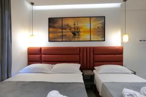 Postel nebo postele na pokoji v ubytování Hotel Eagle