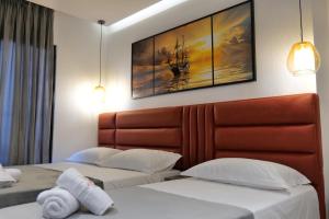 Postel nebo postele na pokoji v ubytování Hotel Eagle
