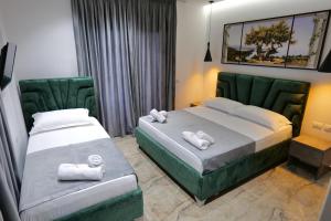 Postel nebo postele na pokoji v ubytování Hotel Eagle