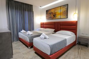 Postel nebo postele na pokoji v ubytování Hotel Eagle