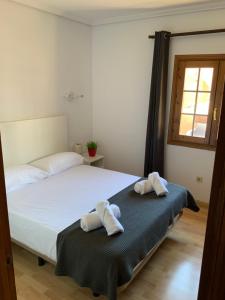 Postel nebo postele na pokoji v ubytování DUPLEX BAHIA SuR RESERVA DE CONFI-ANZA