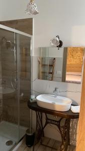 a bathroom with a sink and a shower at Agriturismo Borgo Furma in Enna