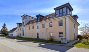 a large house on the side of a street at Panoramawohnung in Peenemünde