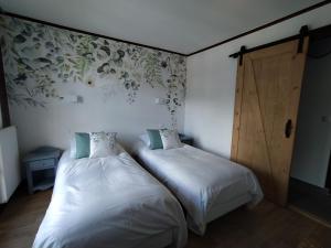 Chalet Appart'Hôtel l'Eau Vive客房内的一张或多张床位