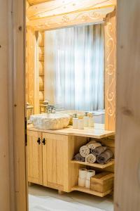 a bathroom with a sink and a mirror at Pyrgielówka- chata Roztoki in Stryszawa