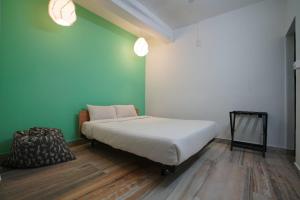 מיטה או מיטות בחדר ב-The Solo Retreat