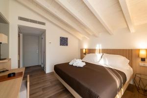 Postel nebo postele na pokoji v ubytování Le Stanze del Lago Villa Seta + 37 fotografií