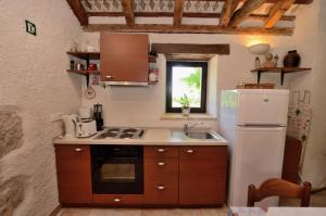 Kuchyň nebo kuchyňský kout v ubytování House Nadija