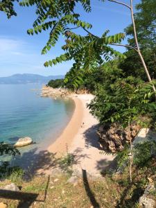 a view of a beach from a cliff at Apartment Tashi, Korzo - Rijeka, 2 bedrooms in Rijeka