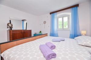 En eller flere senge i et værelse på Apartment Mediterranean