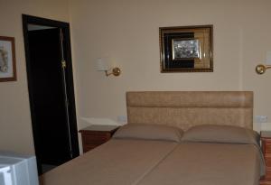 Cama o camas de una habitación en Hotel Roma