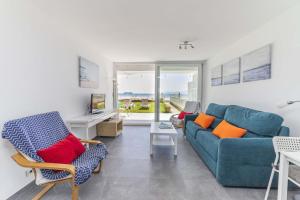 Posedenie v ubytovaní Apartamento Beachfront Sonrisas