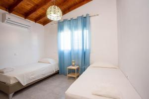 Posteľ alebo postele v izbe v ubytovaní Platanos House + 22 fotografií