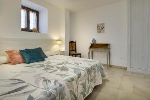 Katil atau katil-katil dalam bilik di Apartamento Rural Paloma