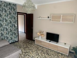 a living room with a flat screen tv on a wall at Apt Sueiras in Burela de Cabo